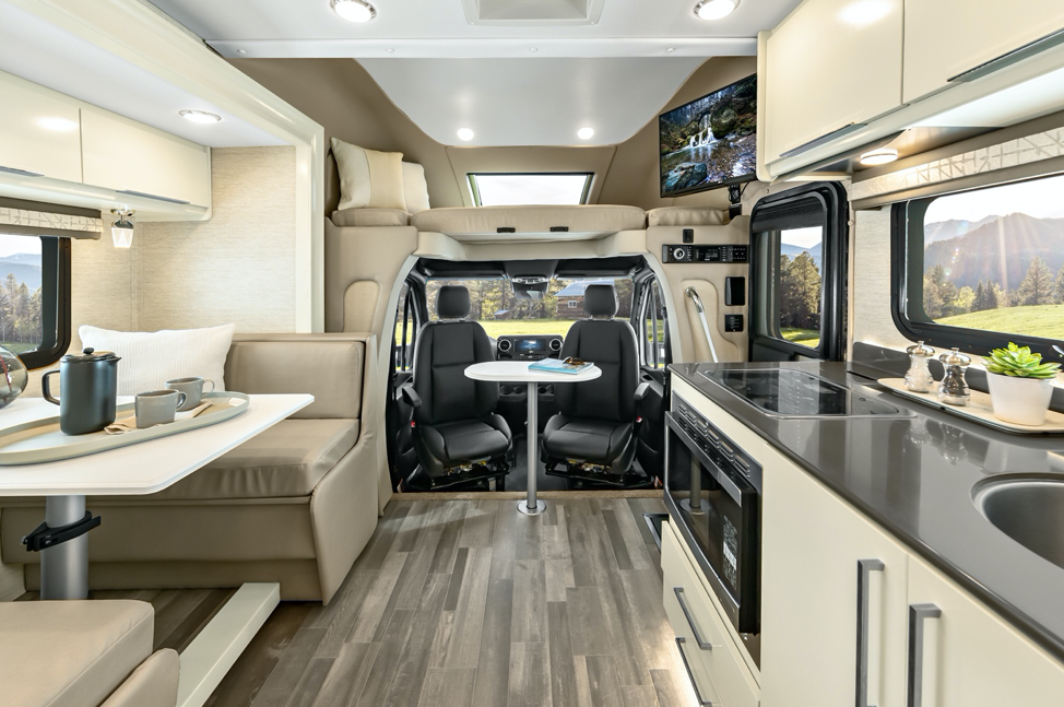 The 2020 Tiffin Wayfarer featuring linen cabinets, white sand leather and fully pivotal front seats.  