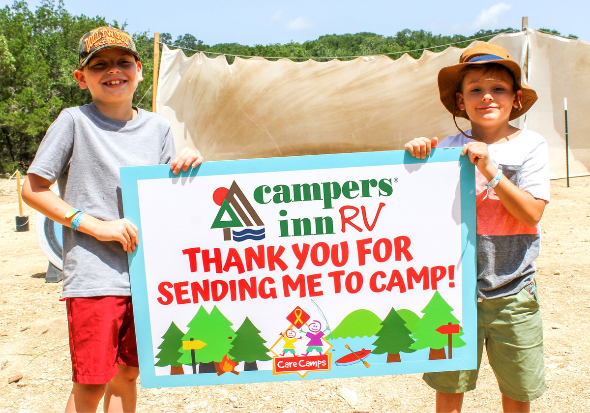 Children at Care Camps holding Thank you Campers Inn RV sign
