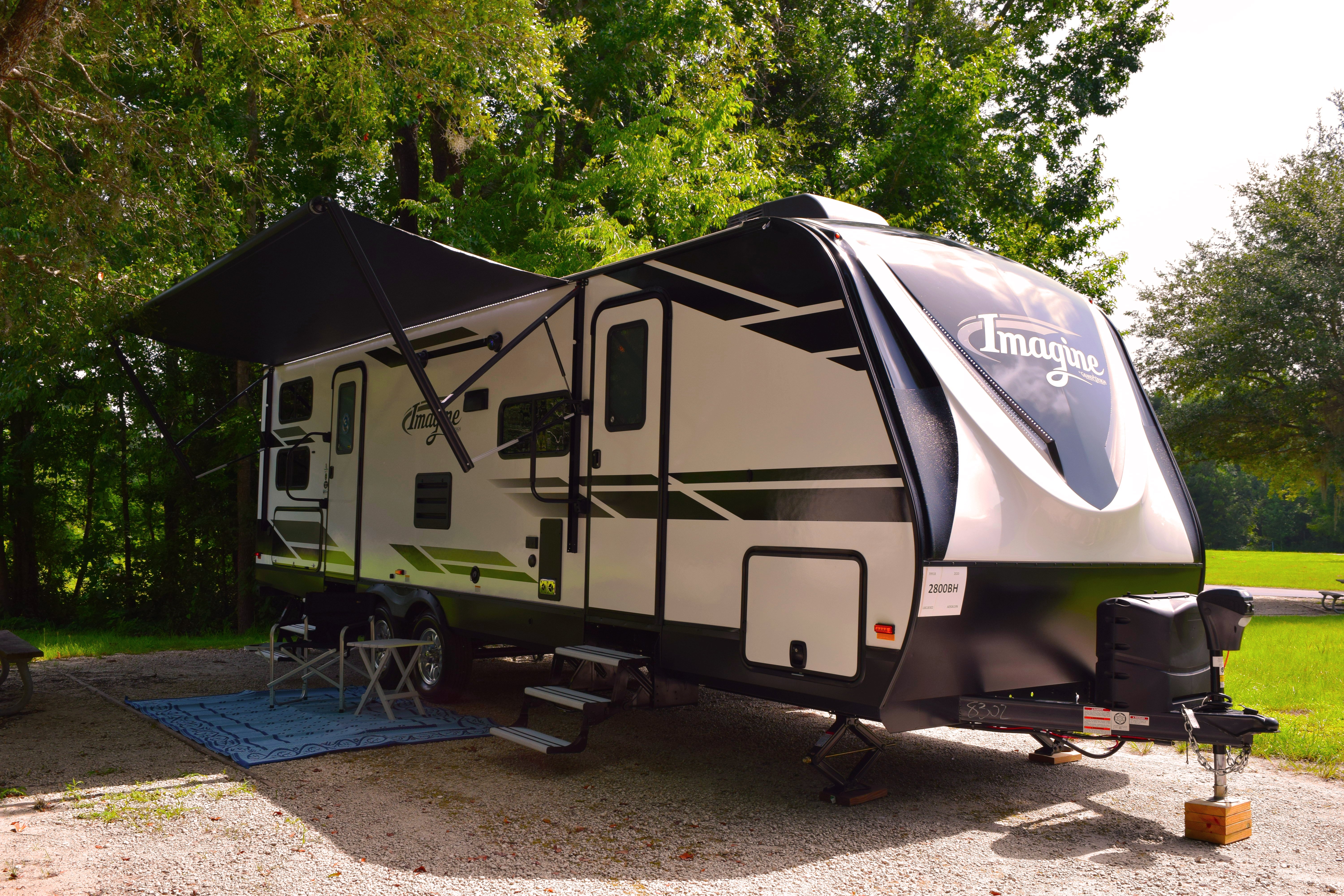 2020 Grand Design Imagine Travel Trailer set up at campground