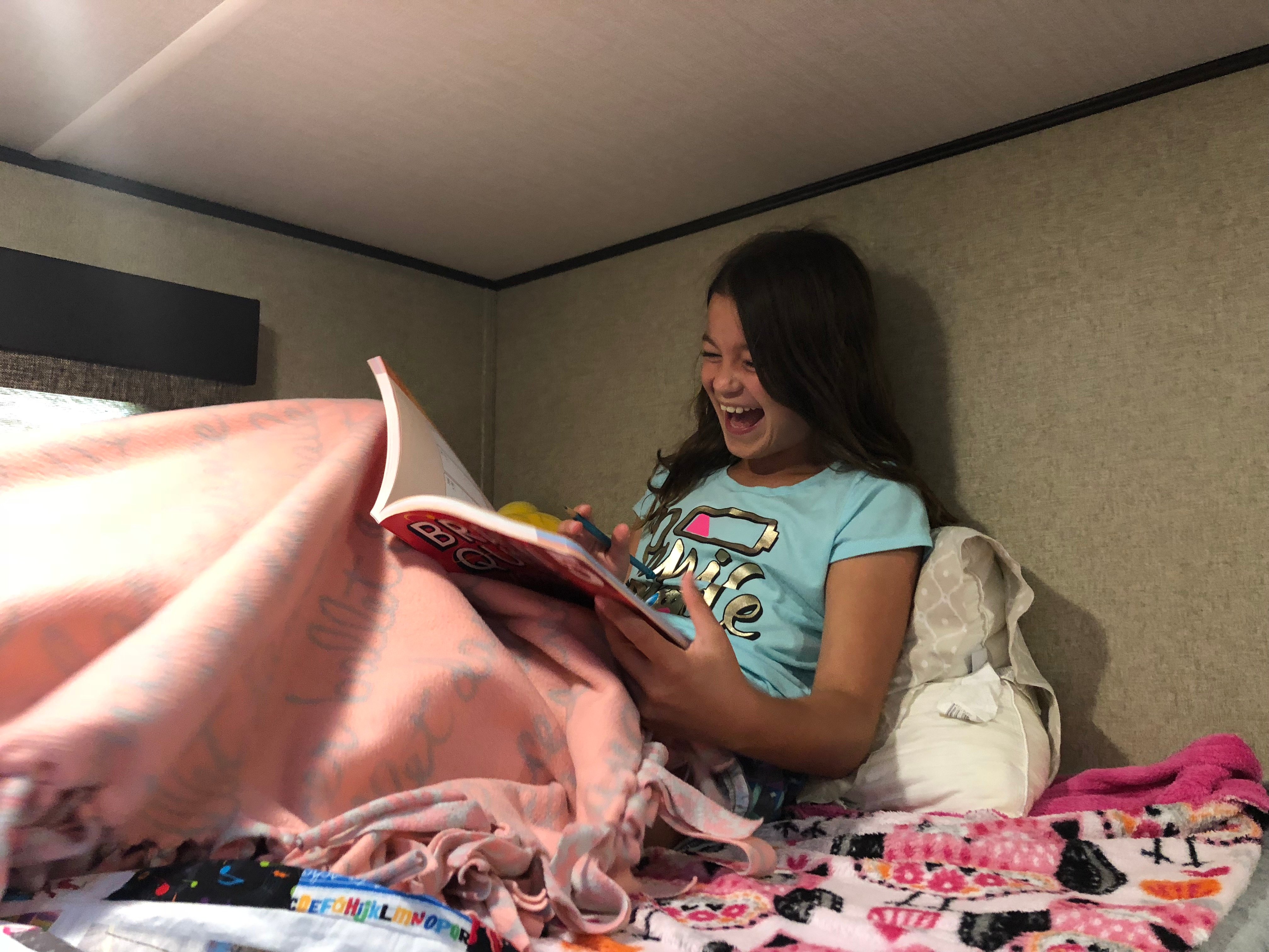 Reading in an RV bunkhouse