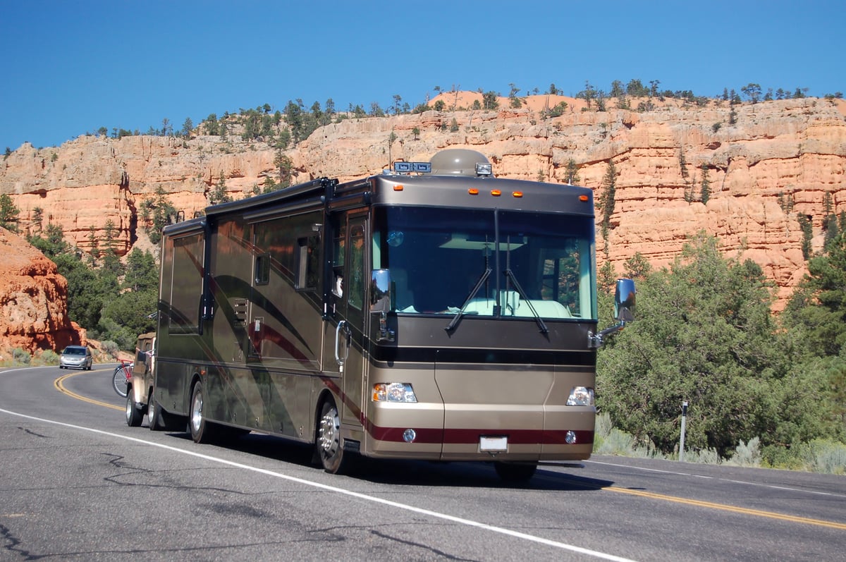 Motorhome driving along mountains