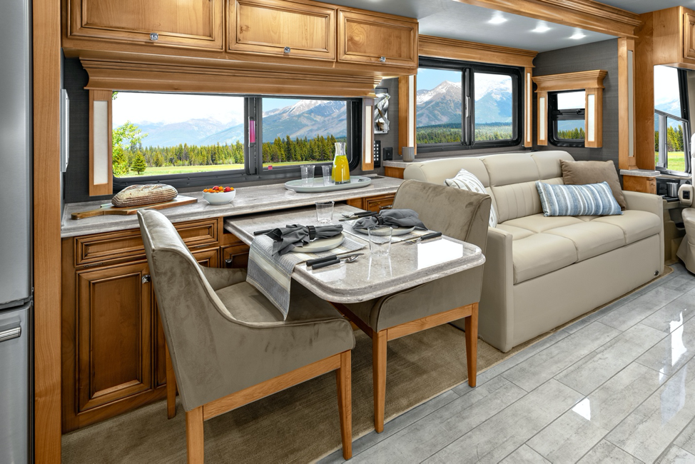 The dining area of the 2020 Tiffin Phaeton featuring a dinette. 