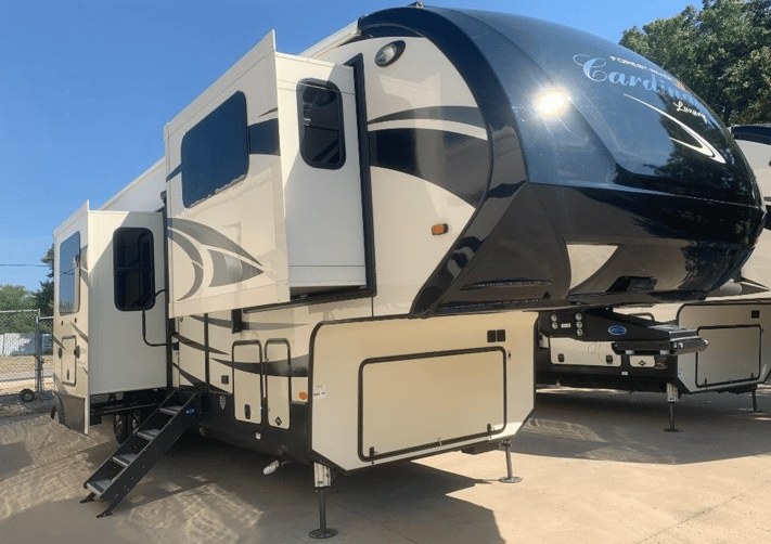 The exterior of the 2020 Forest River Cardinal Luxury 3700FLX fifth wheel featuring five slideouts and a height of over 13 ft. 