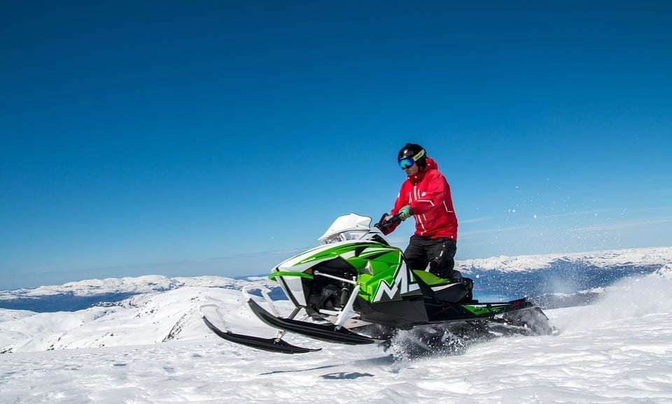 Snowmobile on a snow covered trail