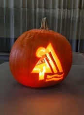 Campers Inn RV logo carved on a pumpkin jack-o-lantern