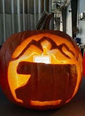 RV carved on a pumpkin jack-o-lantern