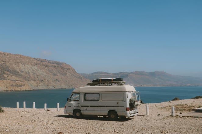 Camper van set up by the ocean