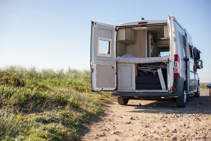 Class B RV opens to show the cozy setup inside