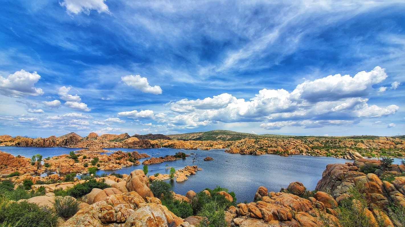 Rocks over Watson Lake in Prescott Arizona with scenic view of clouds in the background