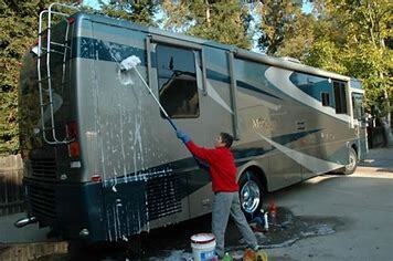 Man washing an RV