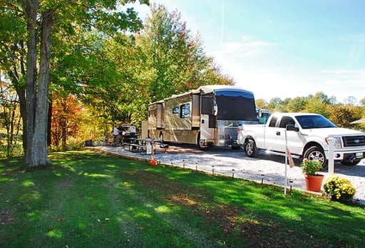 An RV parked in a sunny campsite