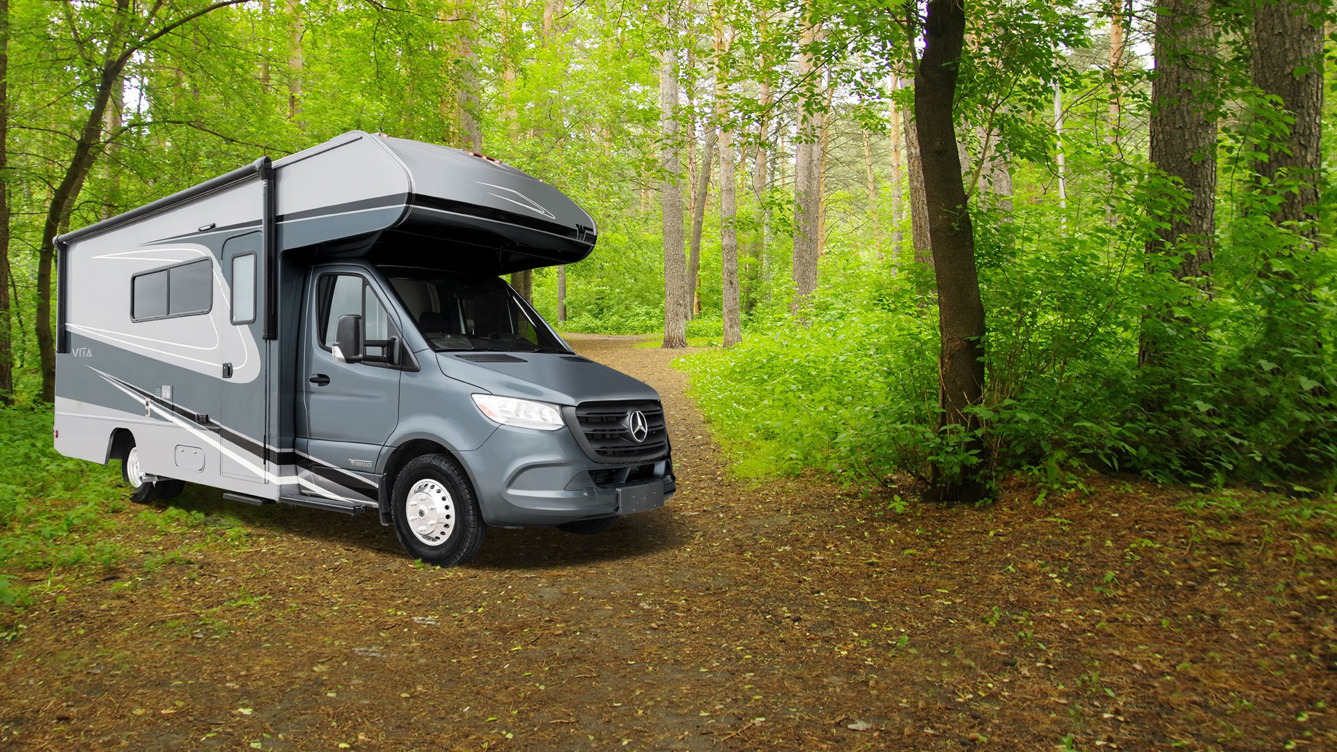 winnebago vita class c motorhome parked in the forest